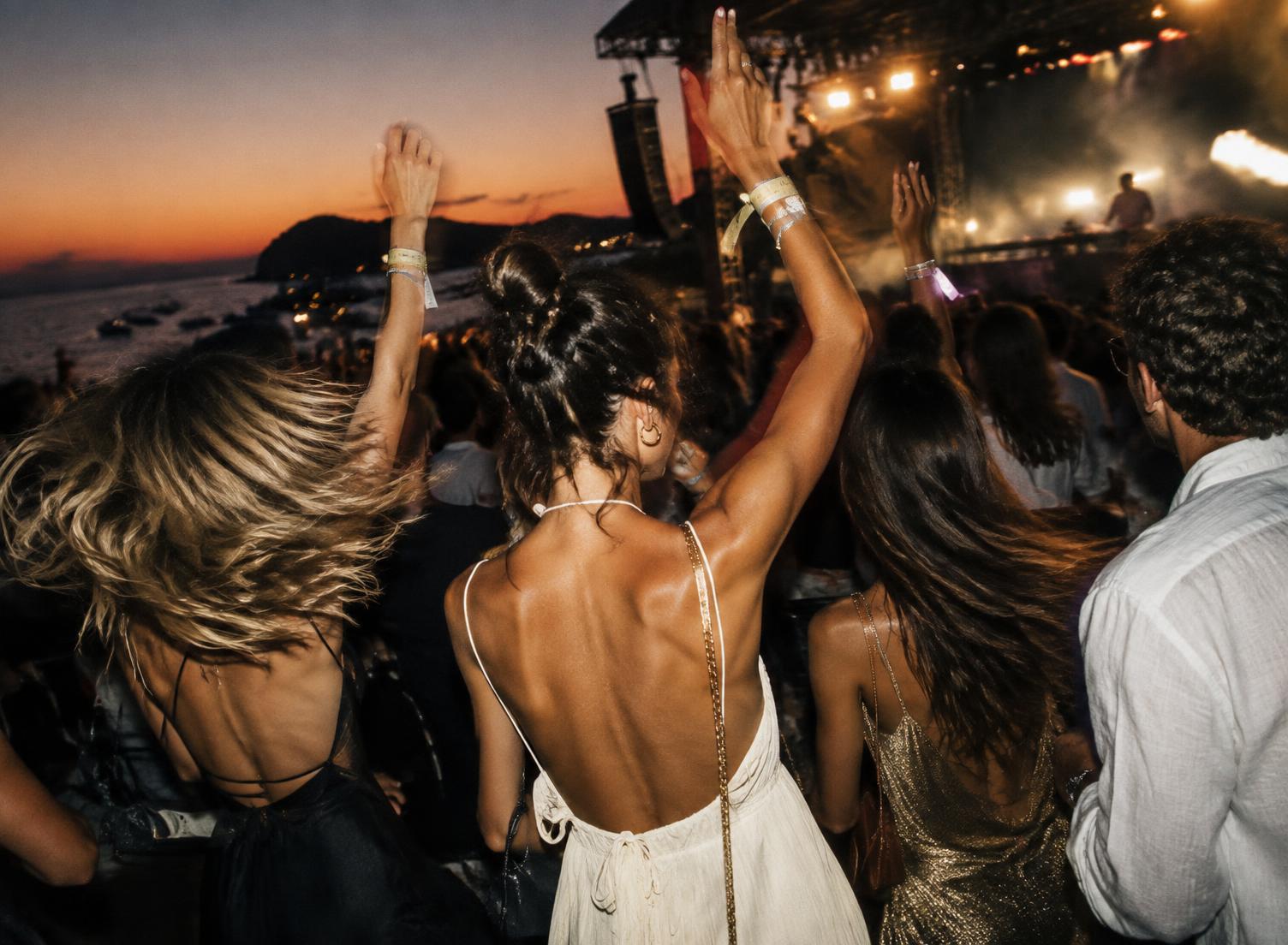 Friends dancing at a festival