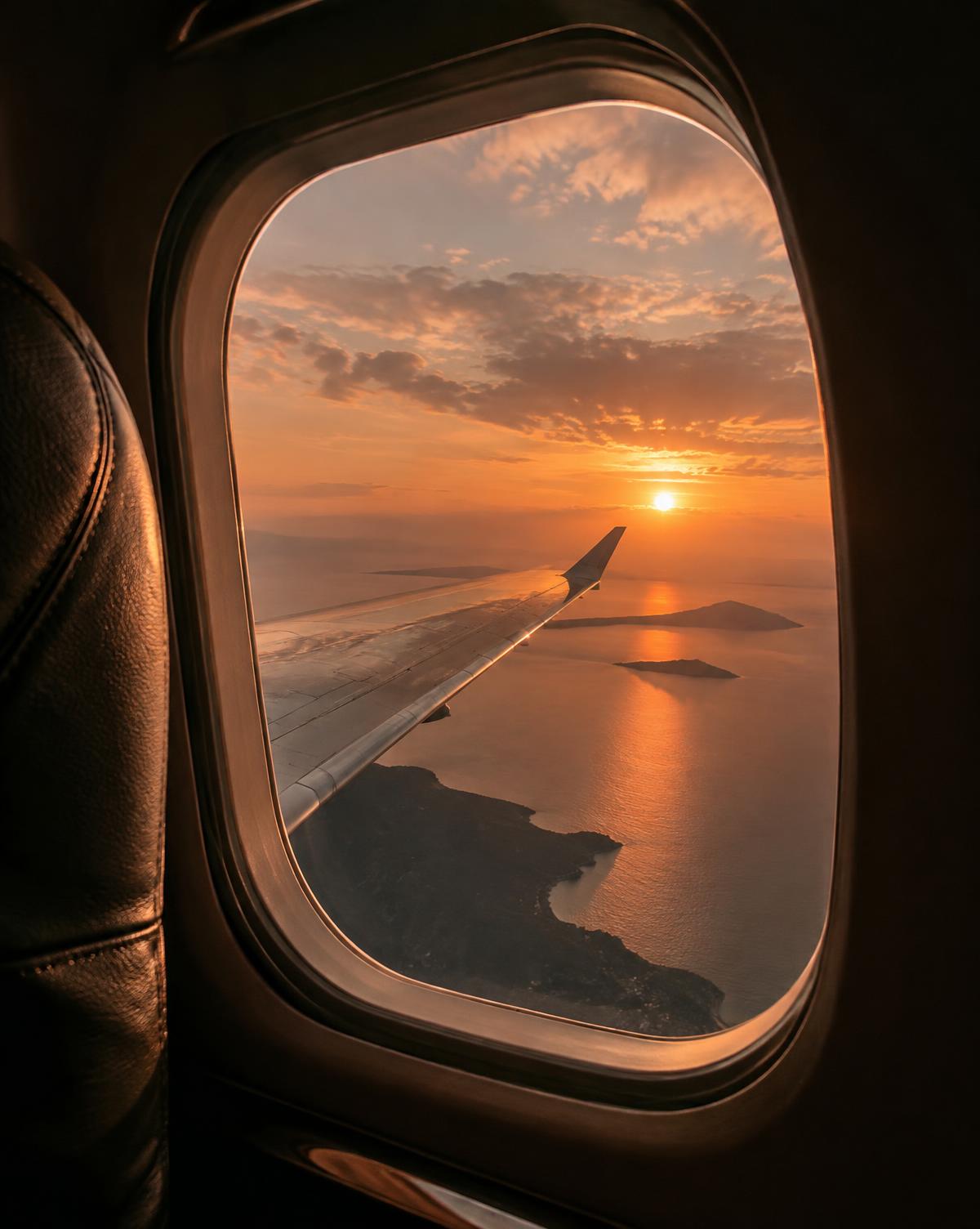 A sunset flight above the coast